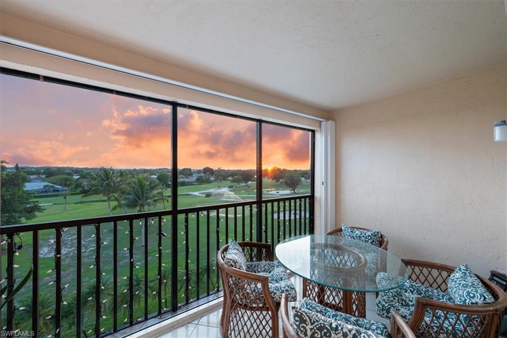 190 Pebble Beach Boulevard, Unit 502 Naples, FL 34113 - Photo 2 of 27 a living room with furniture and a window