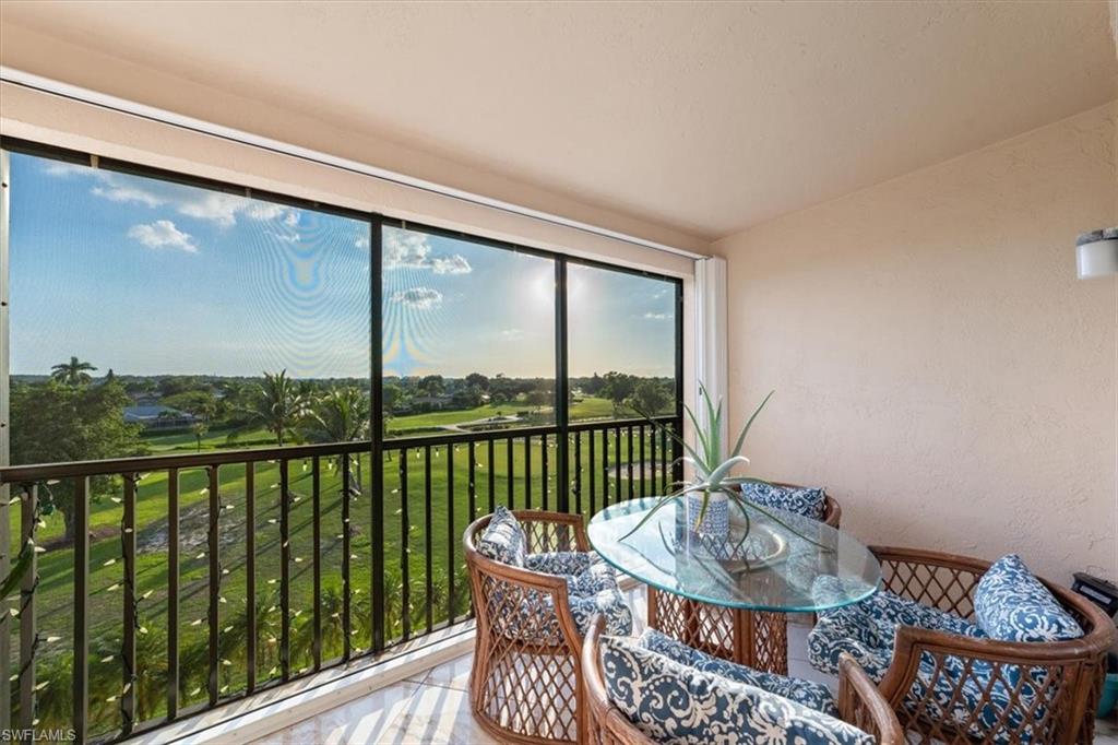 190 Pebble Beach Boulevard, Unit 502 Naples, FL 34113 - Photo 23 of 27 a view of a balcony with furniture