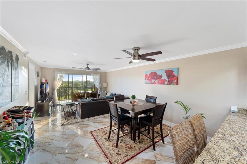 190 Pebble Beach Boulevard, Unit 502 Naples, FL 34113 - Photo 9 of 27 a view of a livingroom with furniture and a window