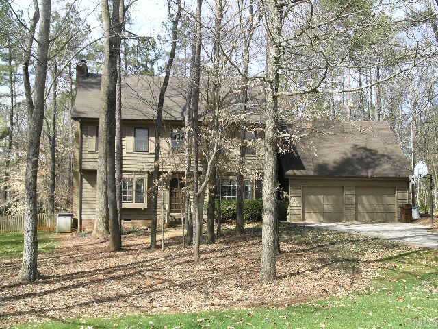 8617 Wellsley Way Raleigh, NC 27613 - Photo 1 of 1 a view of a wooden house with a yard