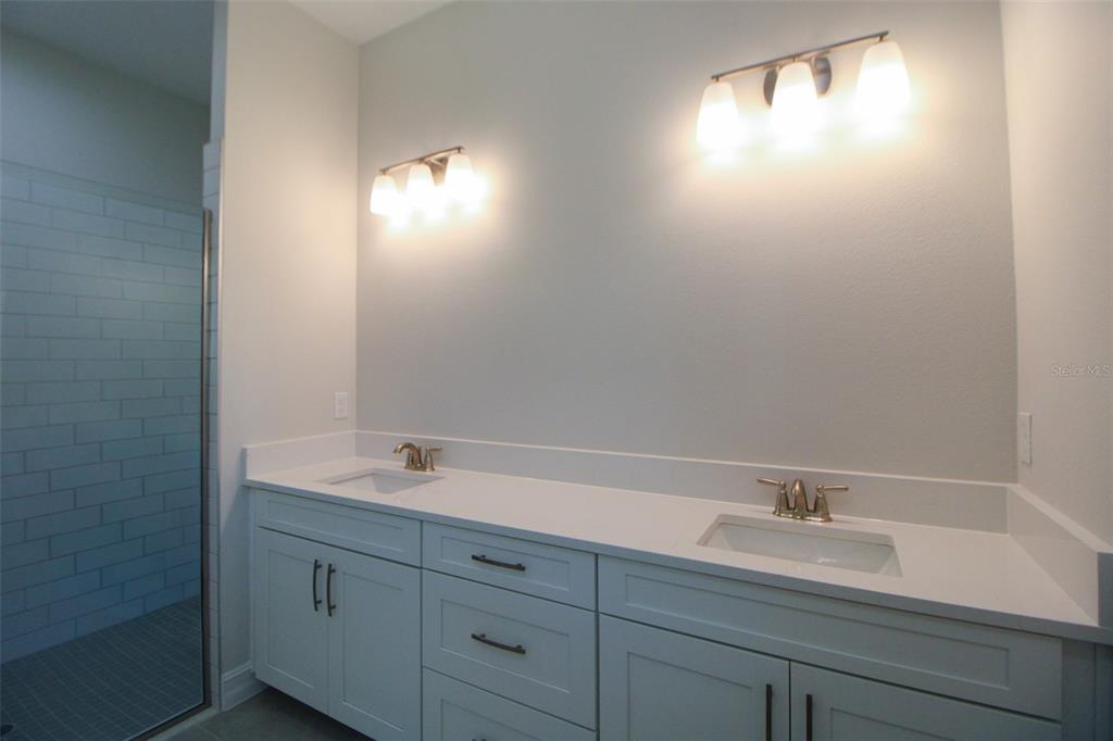 6671 Summit View Drive Brooksville, FL 34601 - Photo 20 of 37 a bathroom with a sink and mirror