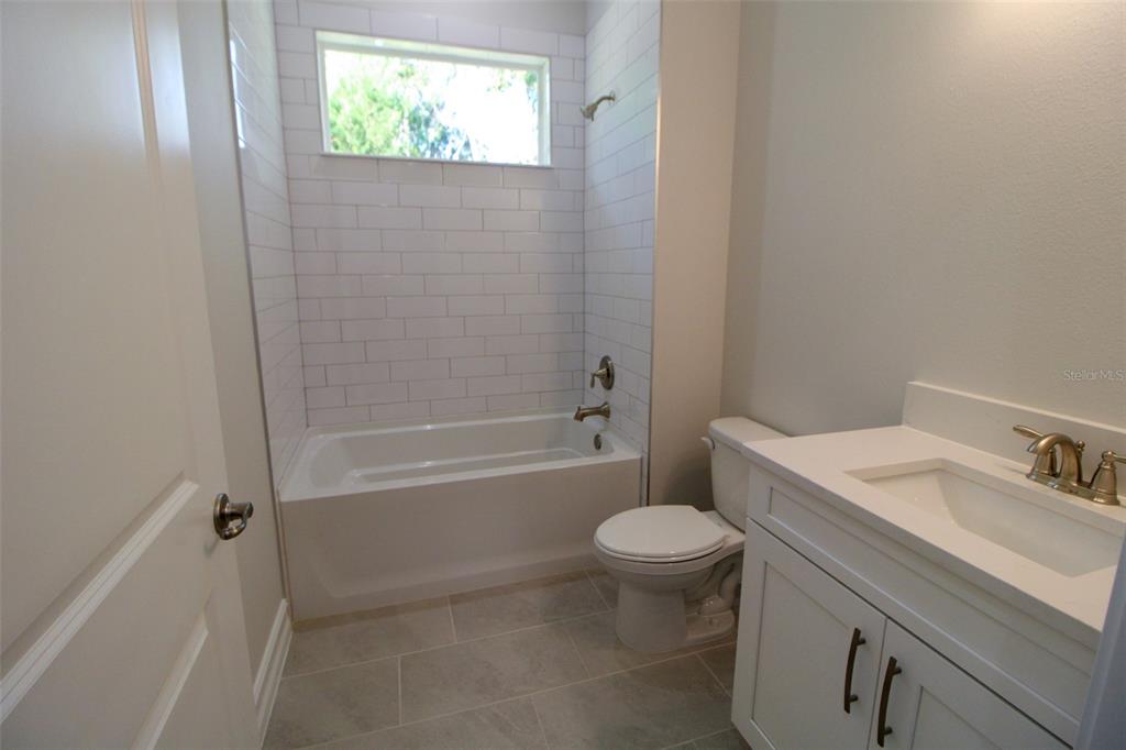 6671 Summit View Drive Brooksville, FL 34601 - Photo 24 of 37 a bathroom with a sink toilet and bathtub