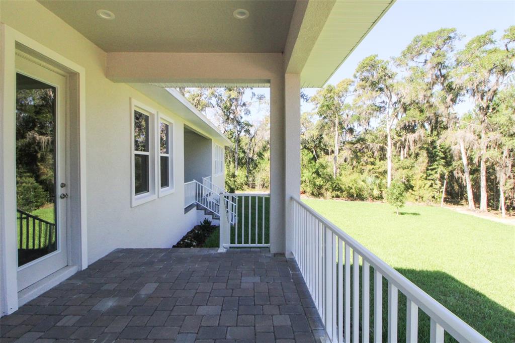 6671 Summit View Drive Brooksville, FL 34601 - Photo 32 of 37 a view of a porch and garden