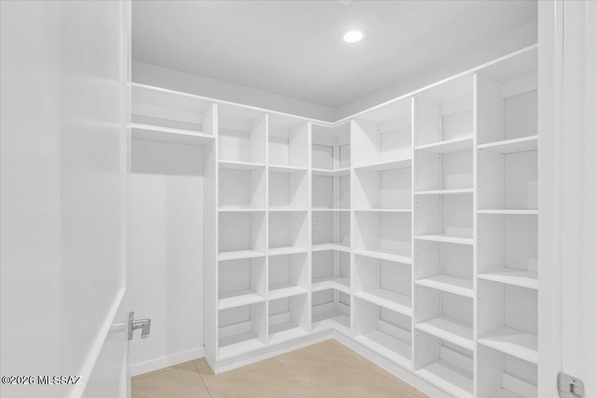 14821 Diamond F Rnch Place Vail, AZ 85641 - Photo 14 of 48 Pantry with Built in Refrigerator Area and shelves for the Costco Run.