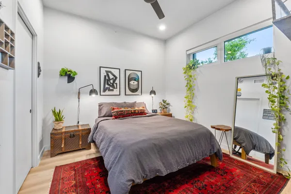 a bedroom with a bed and a couch