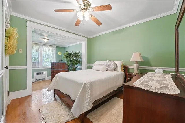 a spacious bedroom with two beds and a chandelier
