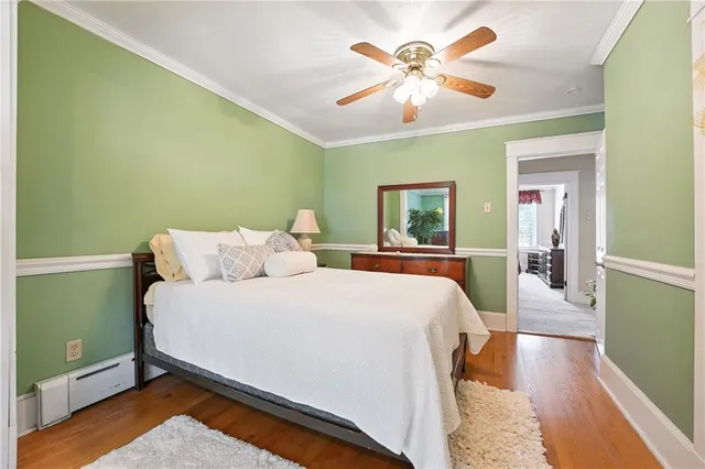 a bed room with a bed and a chandelier