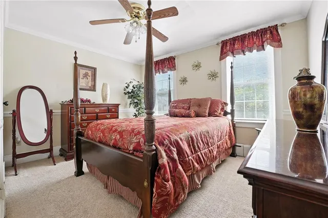 a bedroom with a bed and window