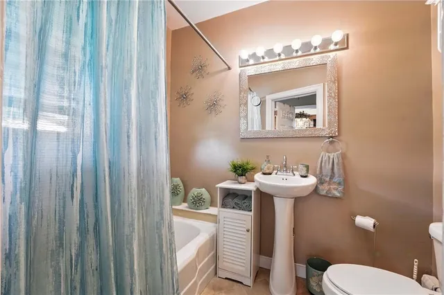 a bathroom with a sink a mirror and a shower