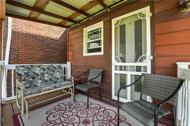 a view of a room with wooden walls