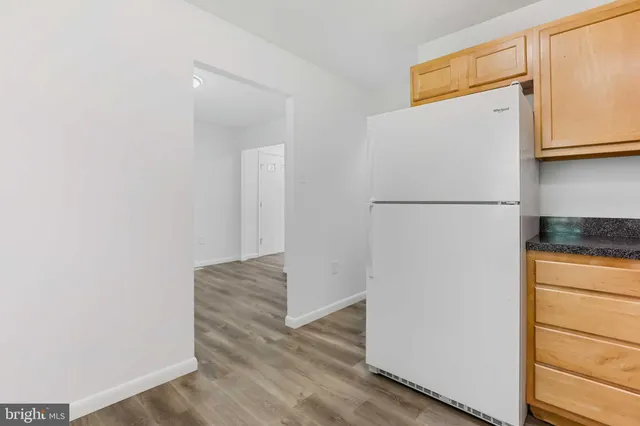 a white refrigerator freezer sitting in a kitchen