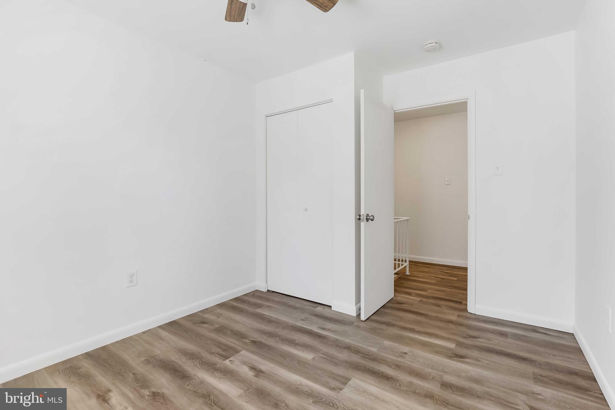 1634 Mt Airy Court Crofton, MD 21114 - Photo 20 of 40 a view of an empty room with wooden floor and closet