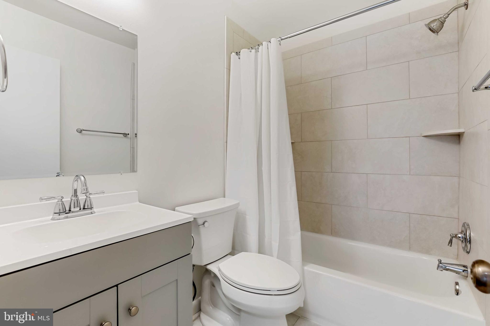 1634 Mt Airy Court Crofton, MD 21114 - Photo 21 of 40 a bathroom with a sink a toilet and shower