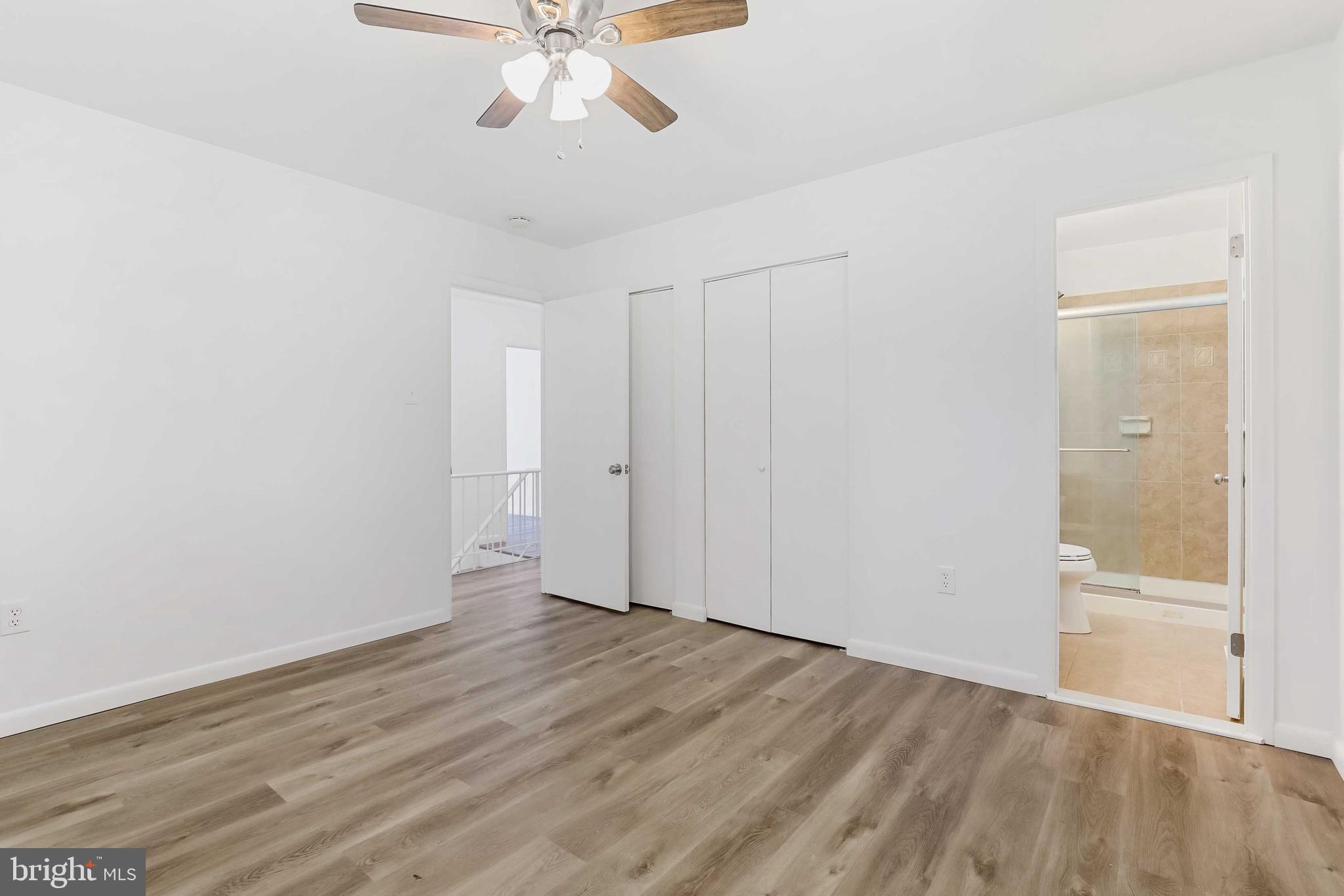 1634 Mt Airy Court Crofton, MD 21114 - Photo 24 of 40 a view of an empty room with wooden floor