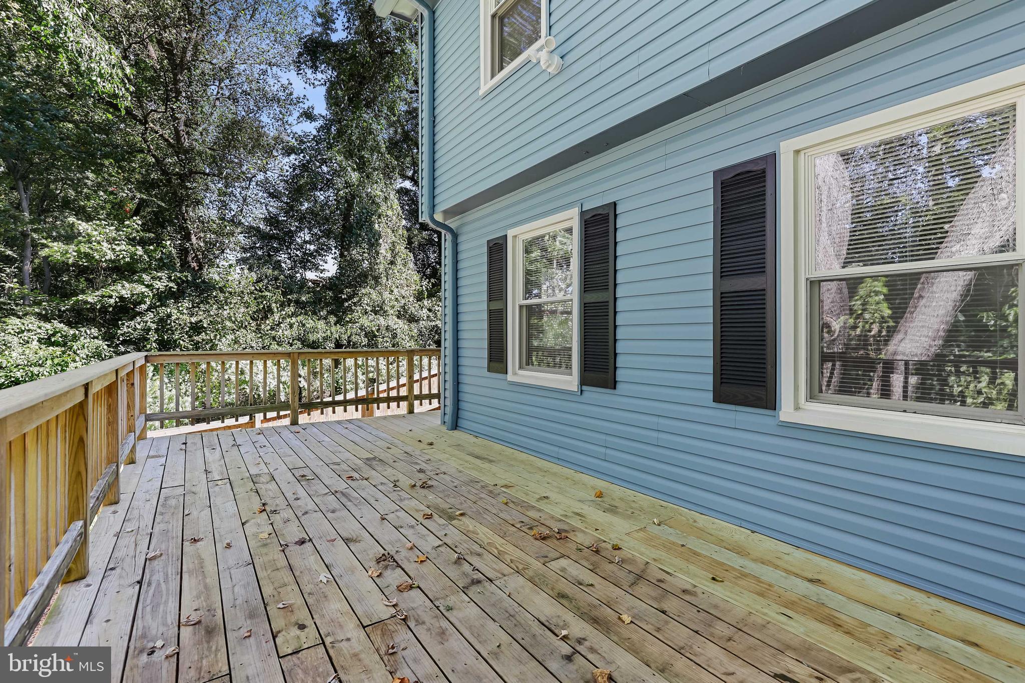 1634 Mt Airy Court Crofton, MD 21114 - Photo 33 of 40 a view of deck with wooden floor and fence next to a yard