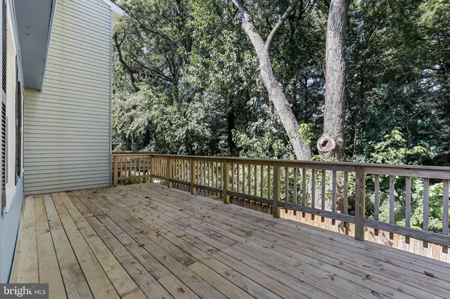 a view of deck with wooden floor and fence