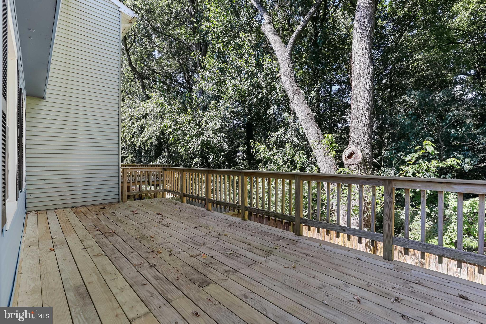 1634 Mt Airy Court Crofton, MD 21114 - Photo 35 of 40 a view of deck with wooden floor and fence