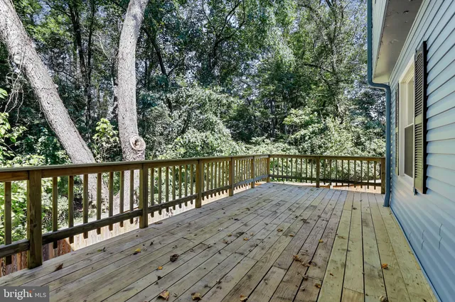a view of balcony with wooden floor