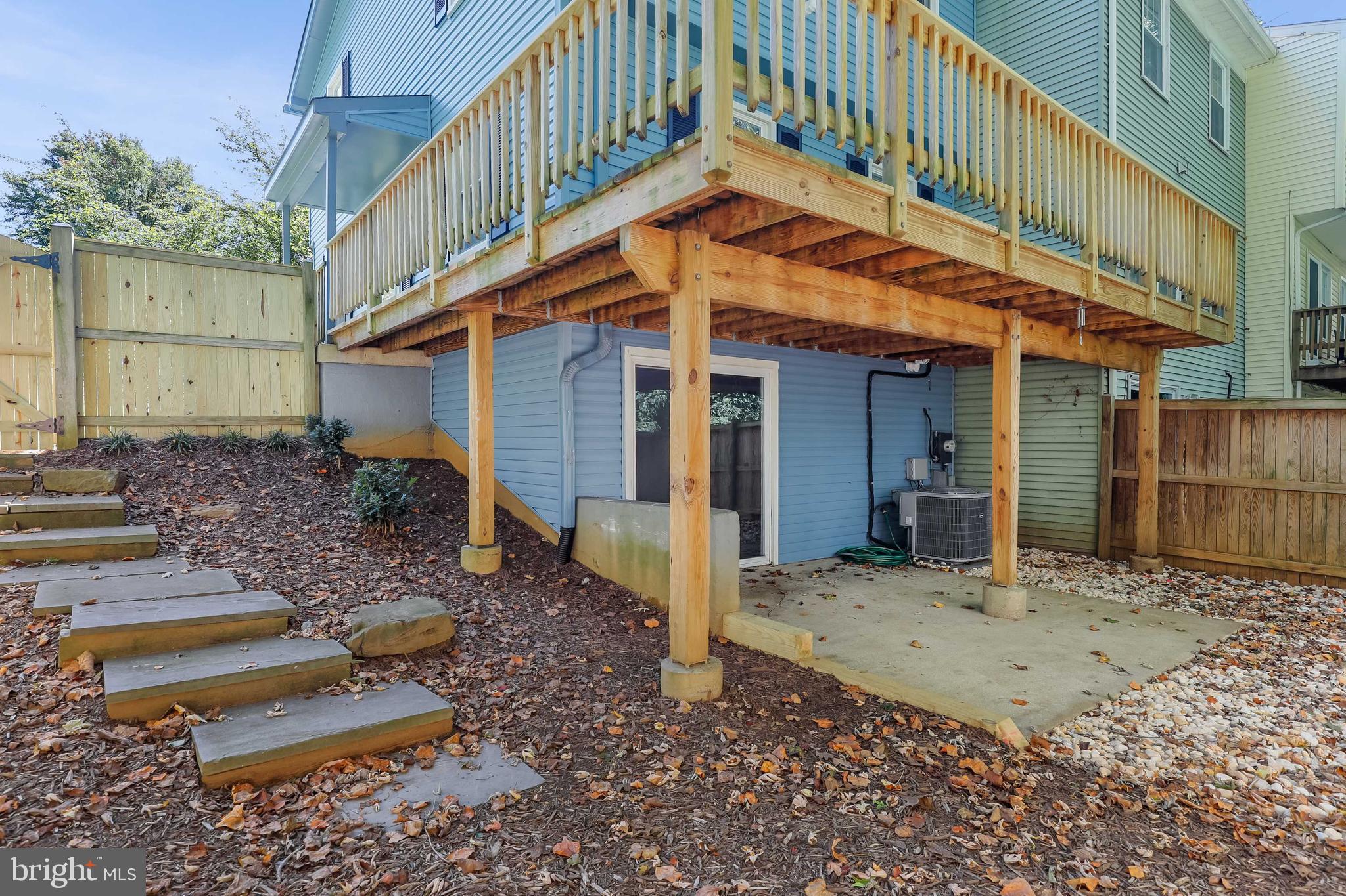 1634 Mt Airy Court Crofton, MD 21114 - Photo 40 of 40 a backyard of a house with barbeque oven table and chairs