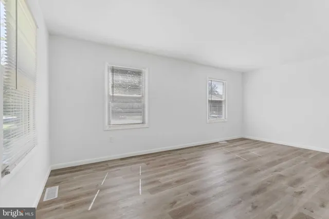 an empty room with windows