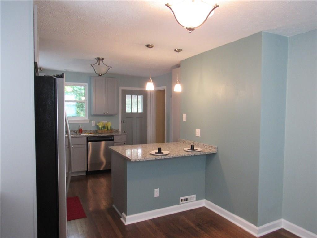 4741 Doyle Road Pittsburgh, PA 15227 - Photo 8 of 22 Contemporary designed kitchen with breakfast bar