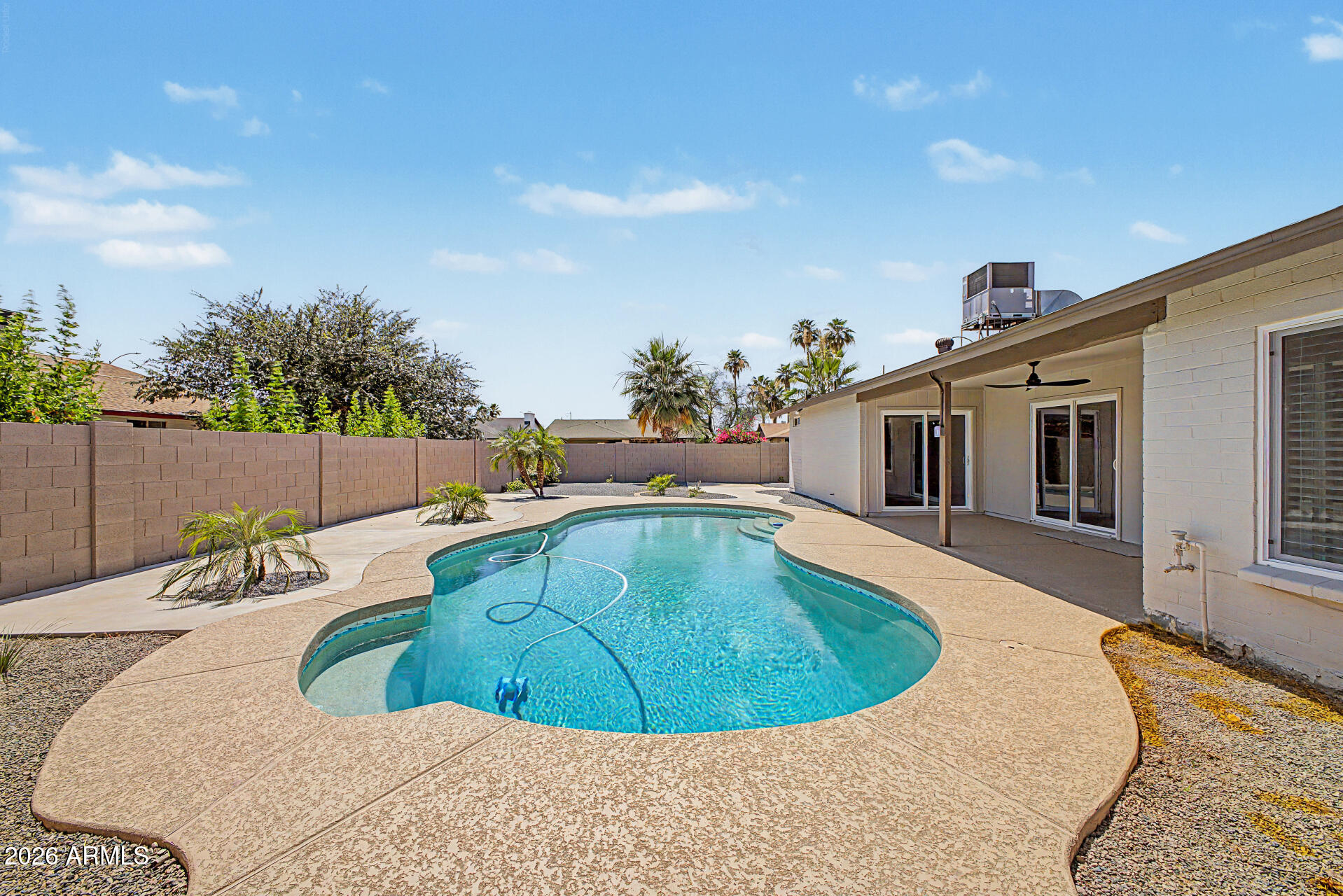 1009 West Pampa Avenue Mesa, AZ 85210 - Photo 29 of 31 a view of a swimming pool with a patio