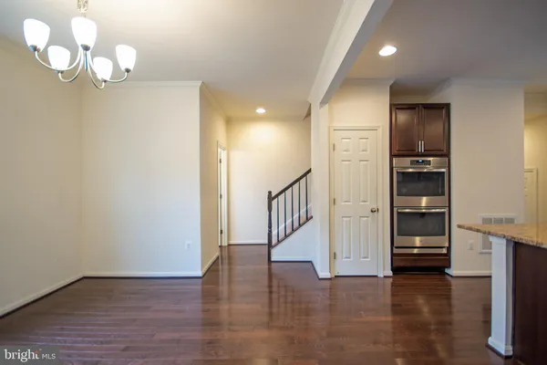 a view of an entryway with wooden floor