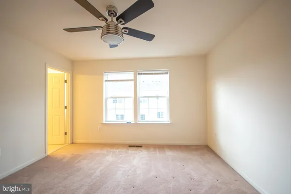 a bathroom with a double vanity sink toilet and shower