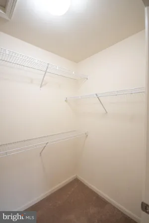 a bathroom with a sink vanity granite and shower