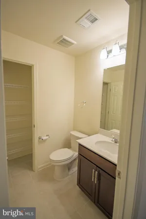 a front view of a house with a yard and a garage