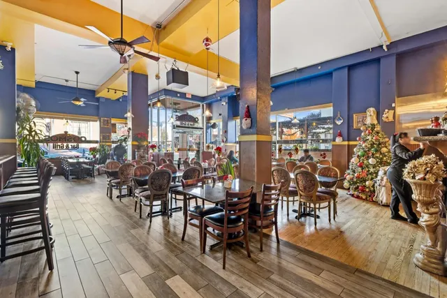 a group of people sitting outside of a building