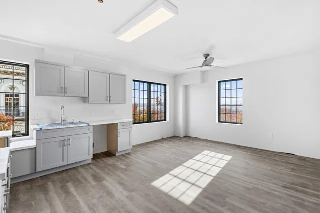 a view of a kitchen with wooden floor
