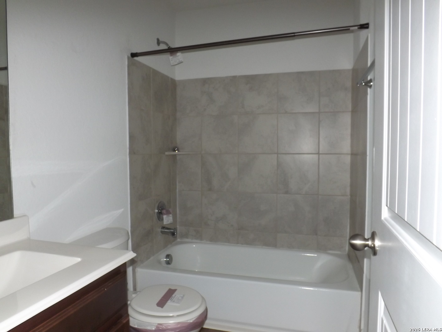 6835 Alaskan Wy. Converse, TX 78109 - Photo 12 of 22 a bathroom with a bathtub and a shower