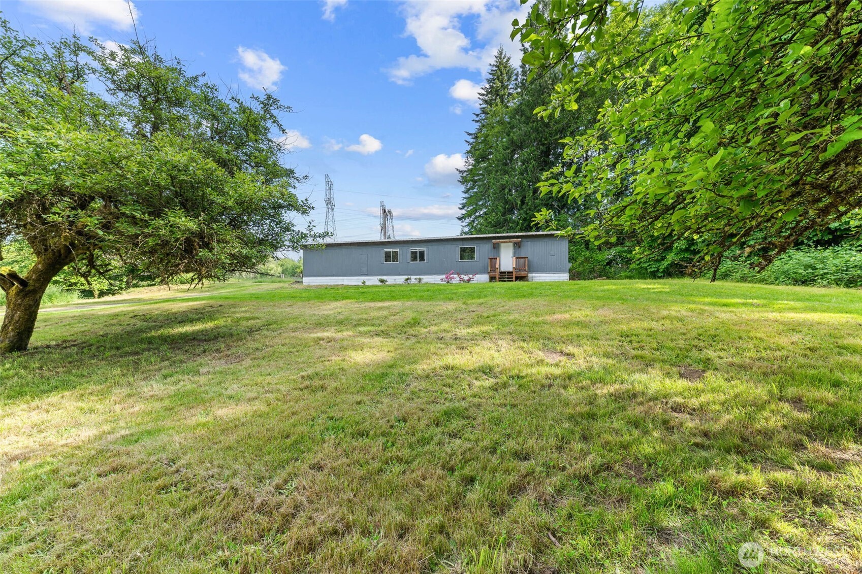 172 South Bank Road Elma, WA 98541 - Photo 6 of 40 a view of a big yard with plants and a small yard