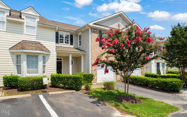 a front view of a house with yard