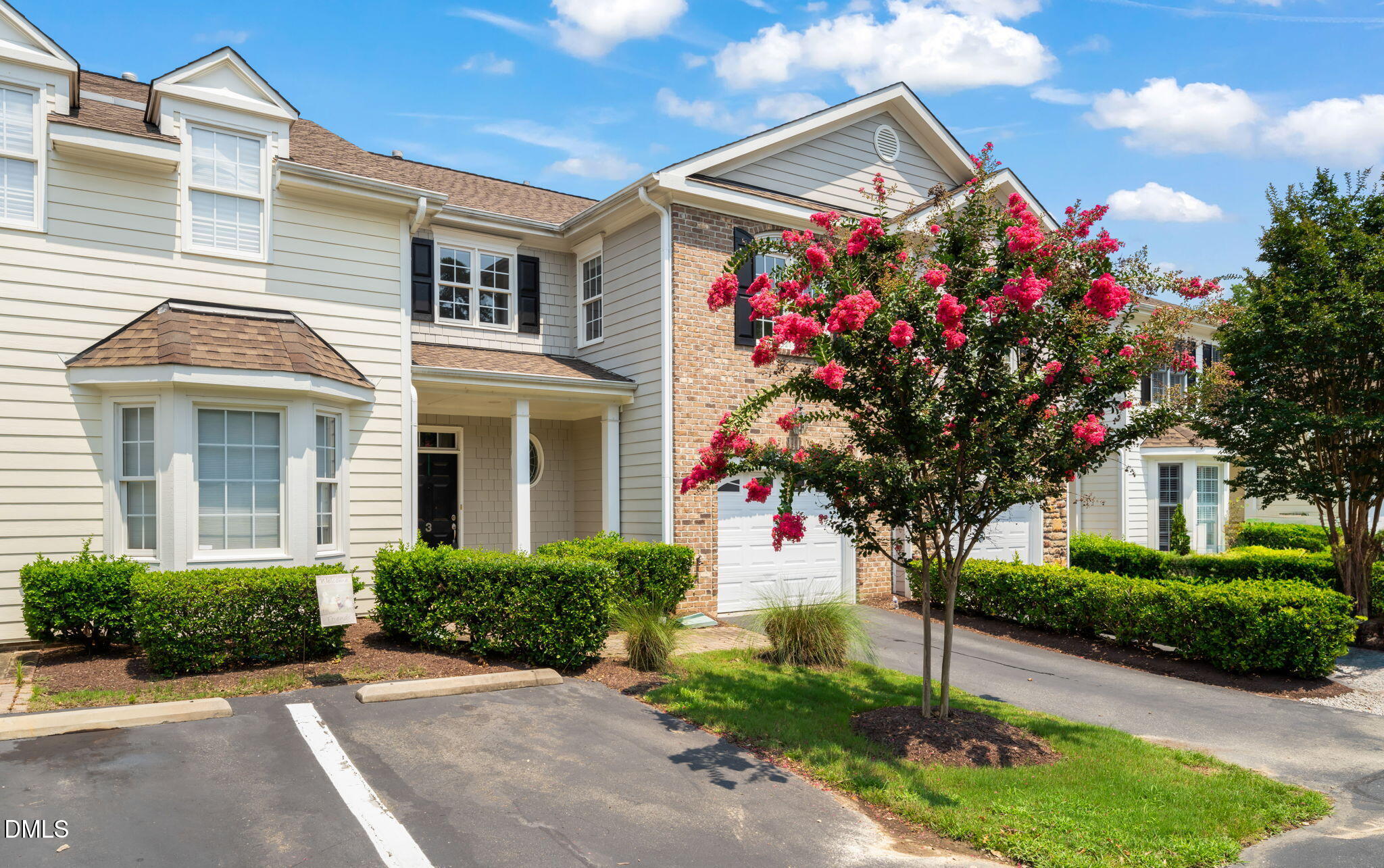 a front view of a house with yard