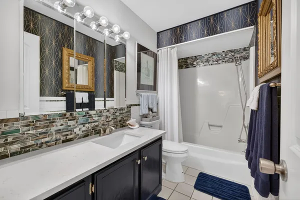 a bedroom with a large bed and a large window