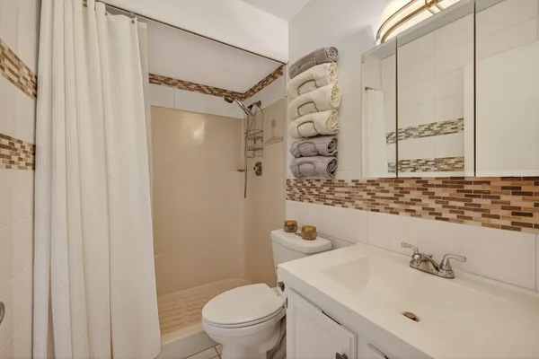 a balcony view with a seating space