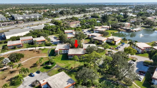 an aerial view of residential houses with city view