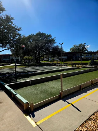 a view of a golf course with a table and chairs