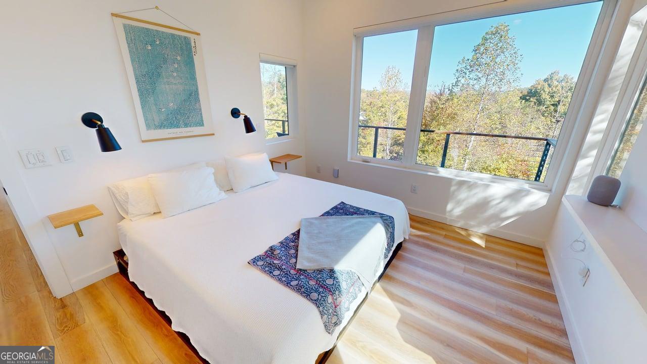 458 Brannon Ridge Young Harris, GA 30582 - Photo 6 of 34 a living room with a bed and a large window