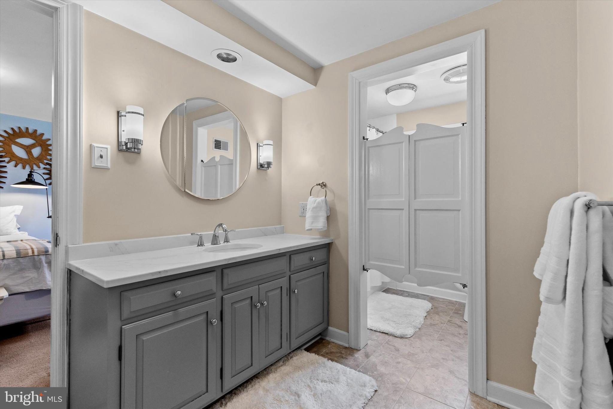 1979 Alcott Road York, PA 17402 - Photo 44 of 115 a bathroom with a toilet a sink a mirror and vanity