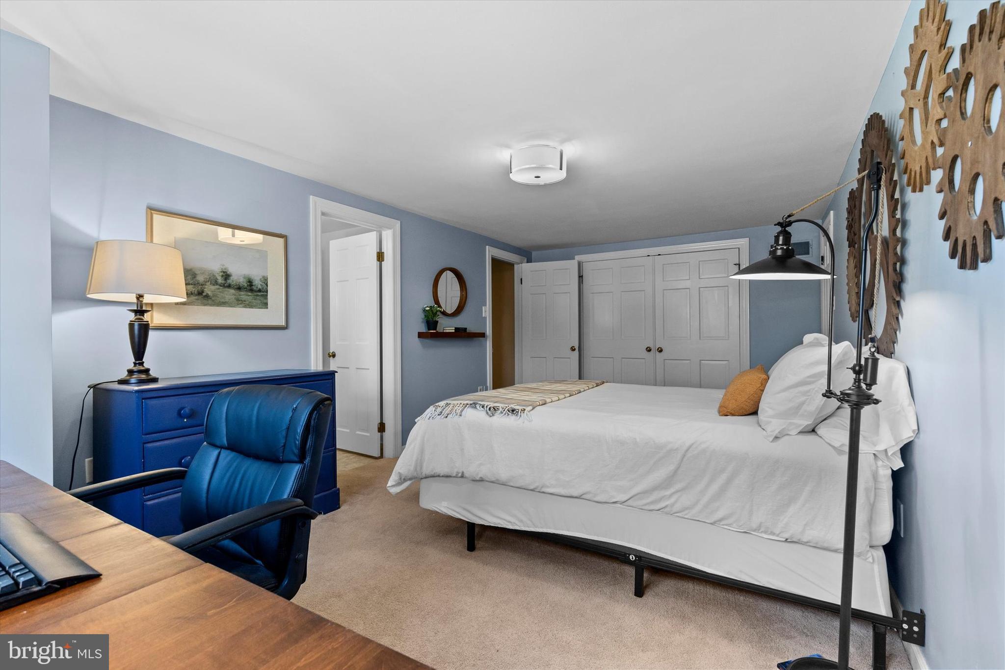 1979 Alcott Road York, PA 17402 - Photo 47 of 115 a bedroom with a bed and a chandelier