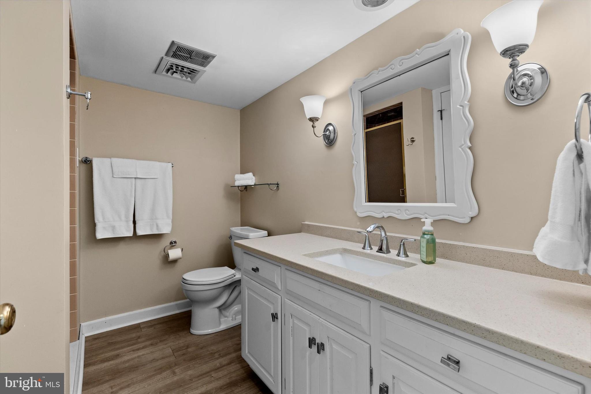 1979 Alcott Road York, PA 17402 - Photo 57 of 115 a bathroom with a granite countertop toilet sink and mirror