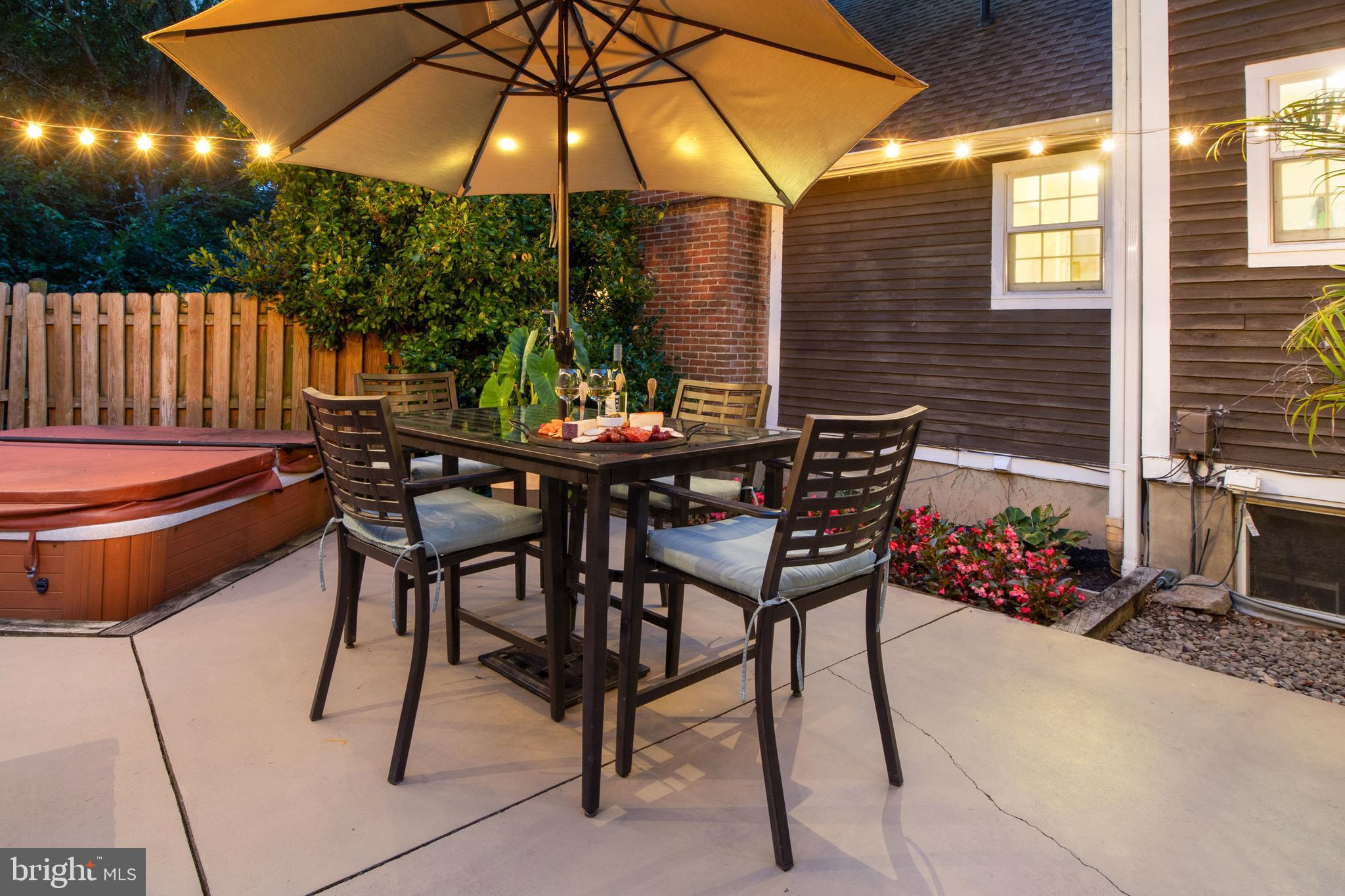 1979 Alcott Road York, PA 17402 - Photo 87 of 115 a patio with a table and chairs under an umbrella