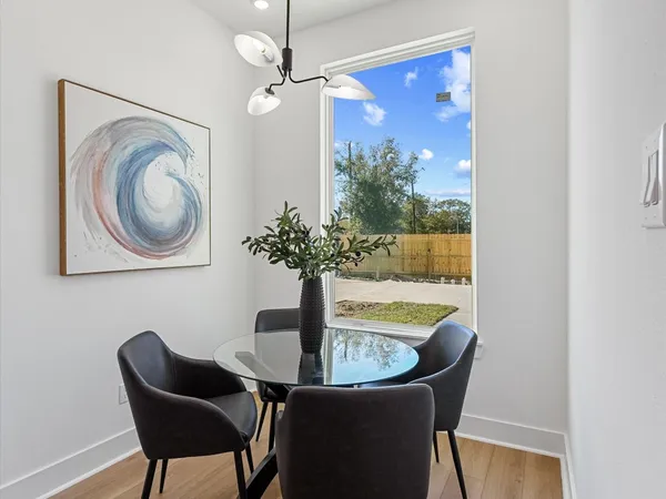 a living room with kitchen island furniture and a wooden floor