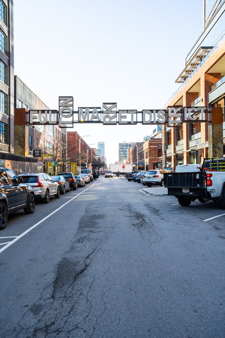 1101 West Lake Street, Unit 3D Chicago, IL 60607 - Photo 48 of 48 a view of a city street with parked cars