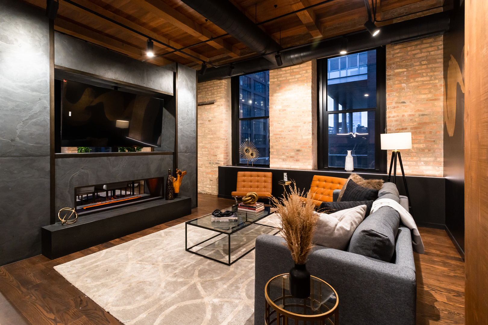 1101 West Lake Street, Unit 3D Chicago, IL 60607 - Photo 7 of 48 a living room with furniture and a flat screen tv