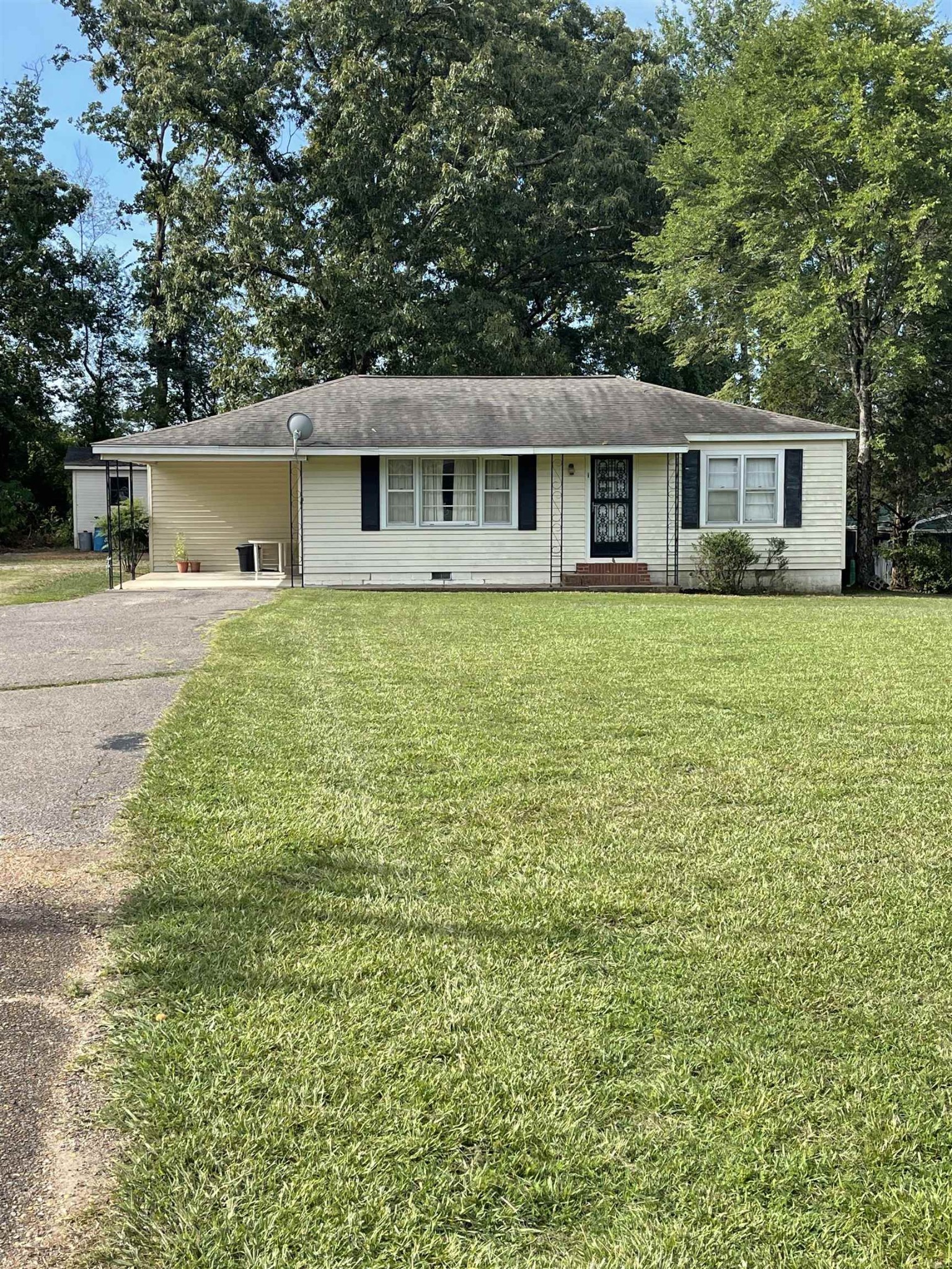 961 Highway 57 Ramer, TN 38367 - Photo 1 of 9 a front view of a house with yard and green space