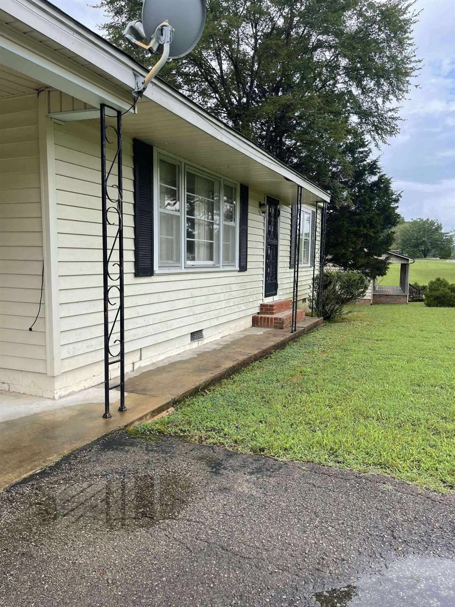 961 Highway 57 Ramer, TN 38367 - Photo 2 of 9 a view of a house with a backyard
